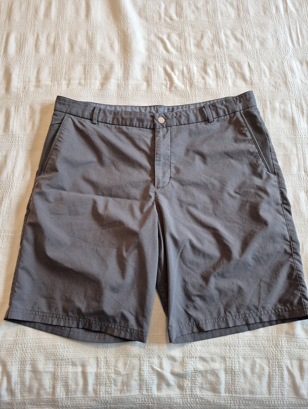 Nike men's size 36 Nike Gold gray shorts, couple popped sitiches on 1 seam only